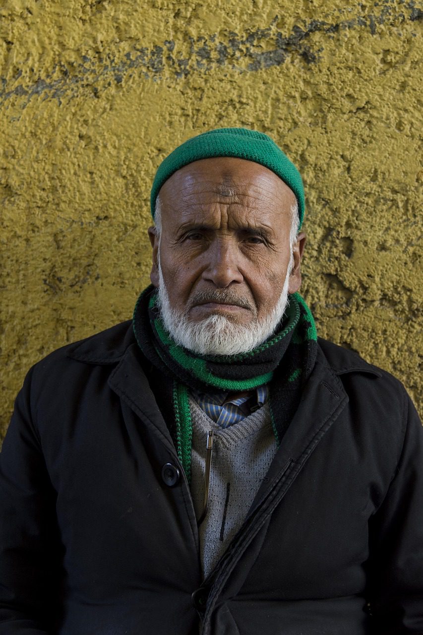 older man stands